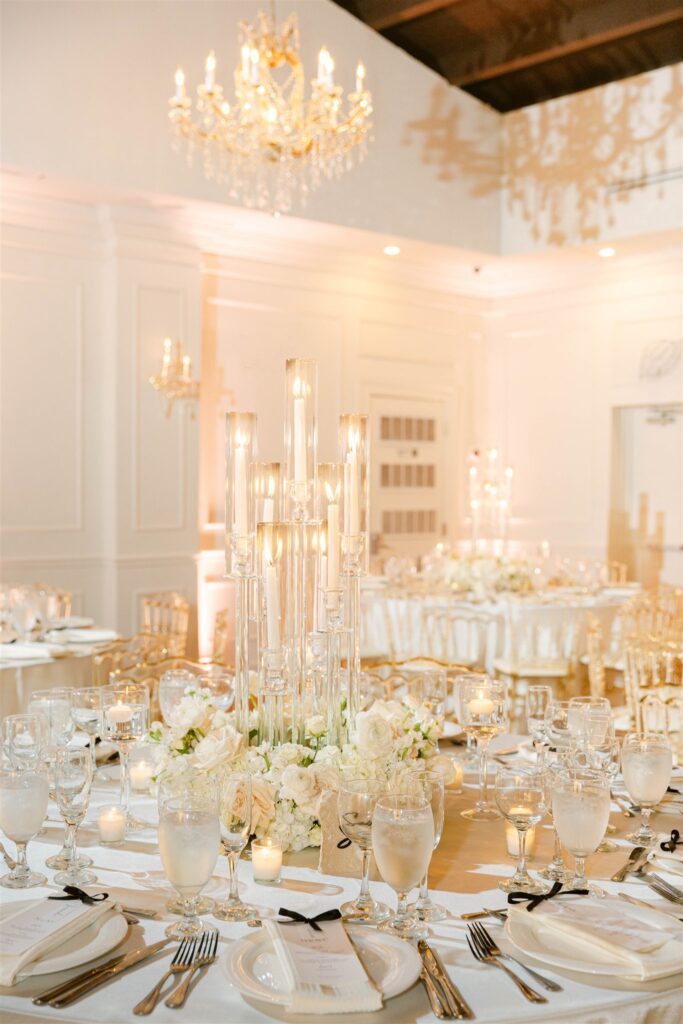 Reception at The Club of Knights with white roses, candles and chandeliers