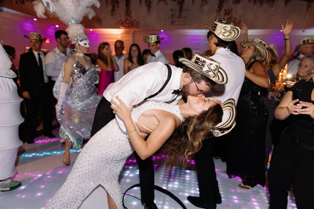 Hora loca performers on the dance floor with the bride