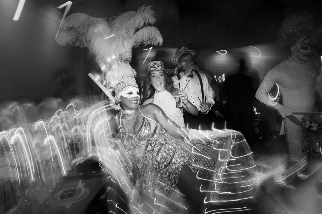 Hora loca performer in a feathered costume