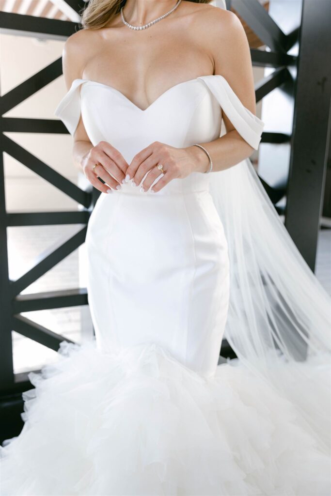 Off-the-shoulder mermaid wedding gown and veil detail