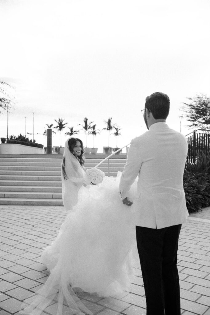 Bride and groom walking up the steps together