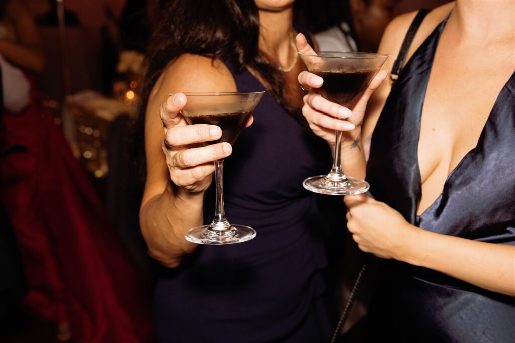 Guests holding espresso martinis