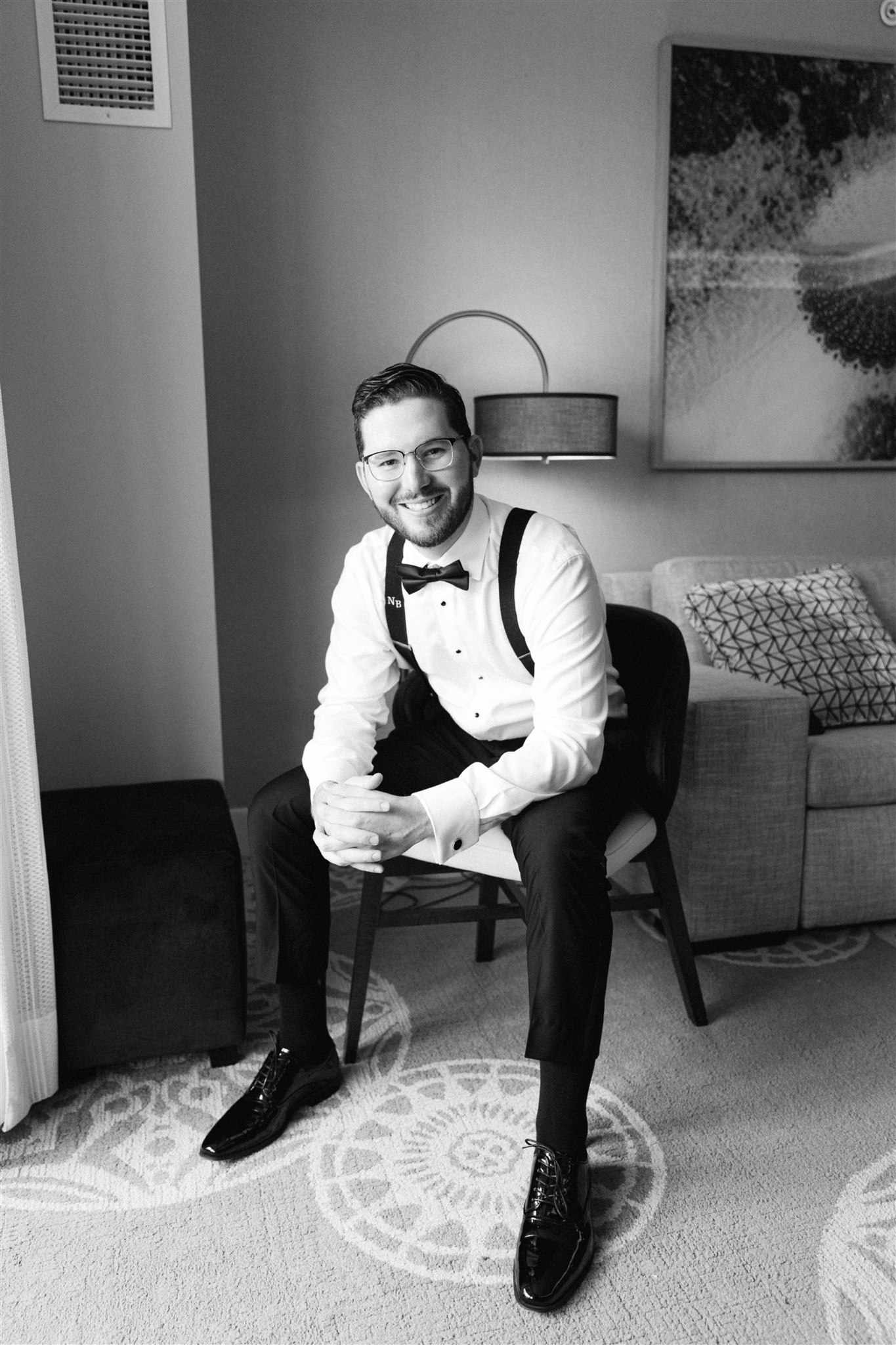Groom seated in his tuxedo before the ceremony