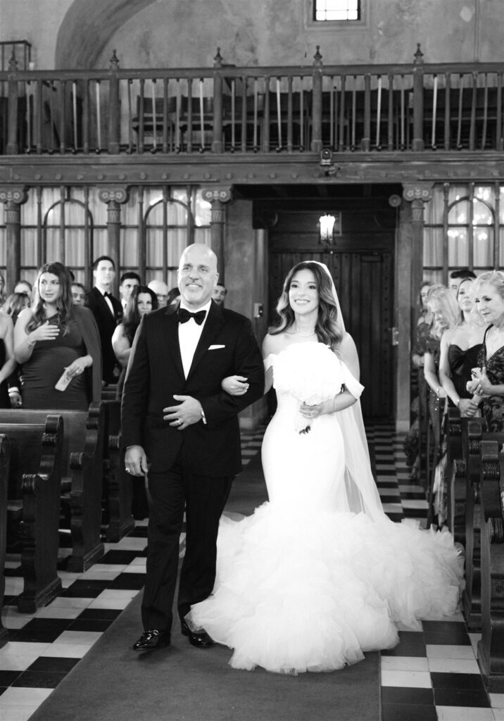 Newlyweds walking back up the aisle
