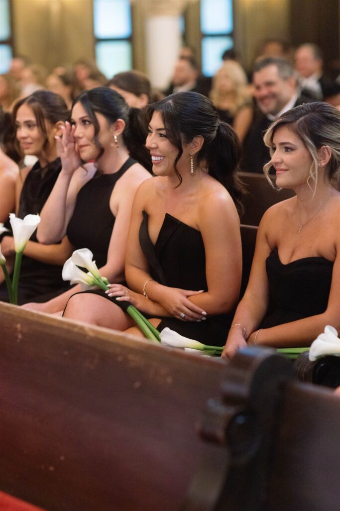 Guests watching the ceremony from the church pews