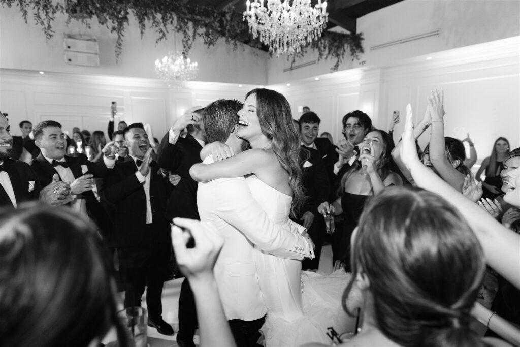 Groom lifting the bride on the dance floor