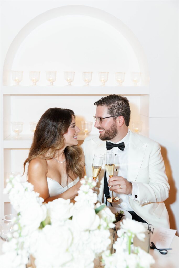 Bride and groom toasting at their sweetheart table