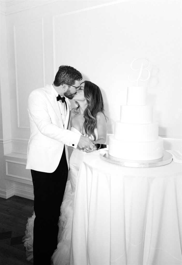 Bride and groom cutting their wedding cake