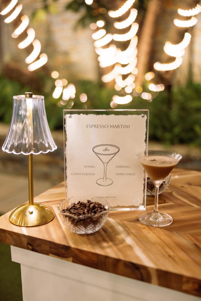 Cocktail hour bar detail with candlelight and a signature drink sign