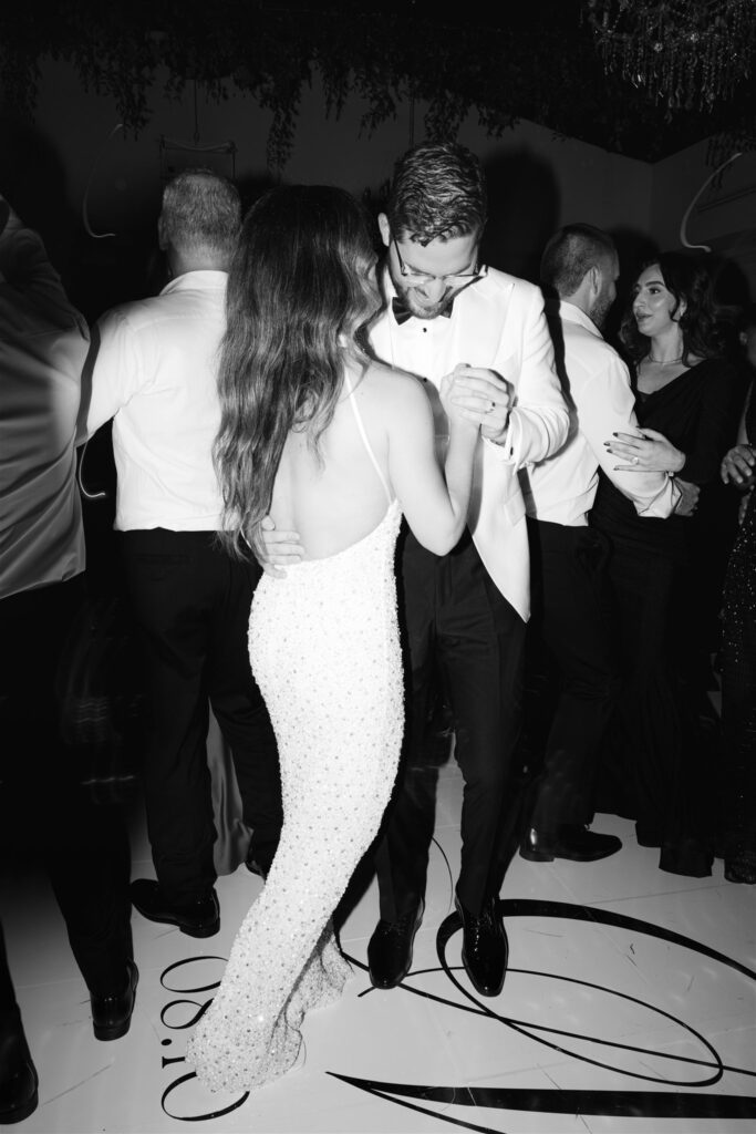 Bride and groom dancing together