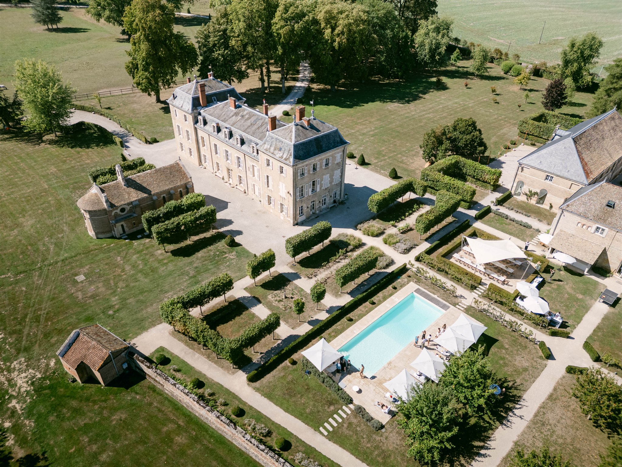 Aerial view of Château de Varennes, its gardens and swimming pool on the morning after