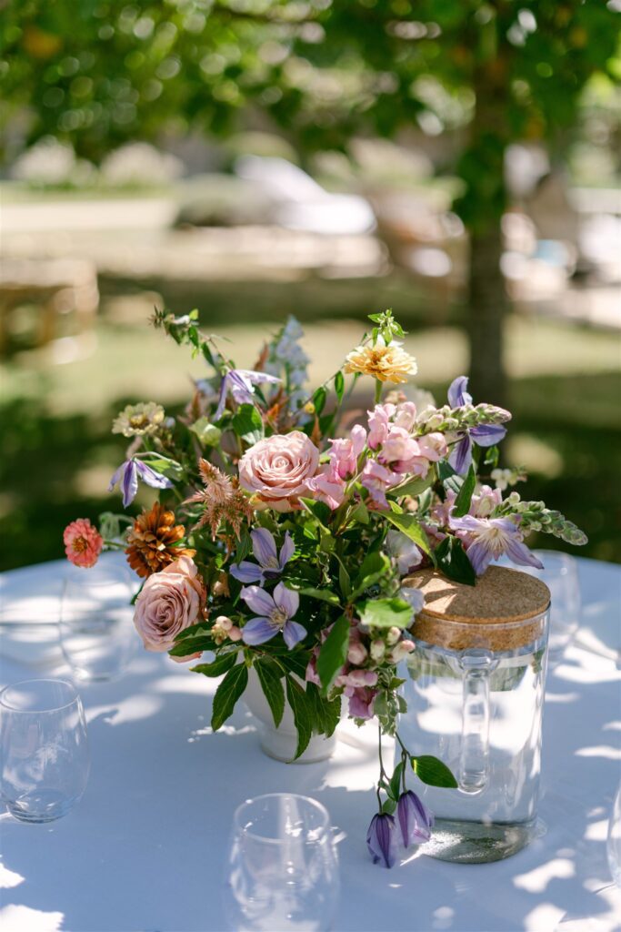 Bouquet of wildflowers in a jar on a brunch table