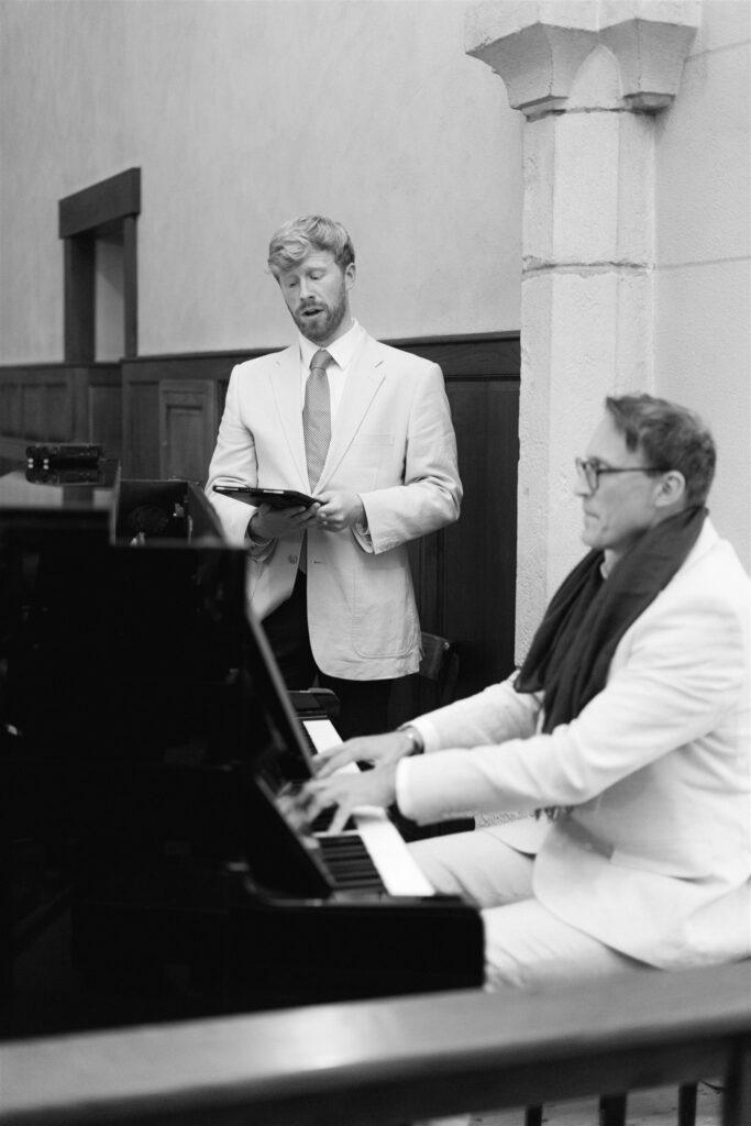 Black and white photo of a pianist and an opera singer performing the Ave Maria in the church