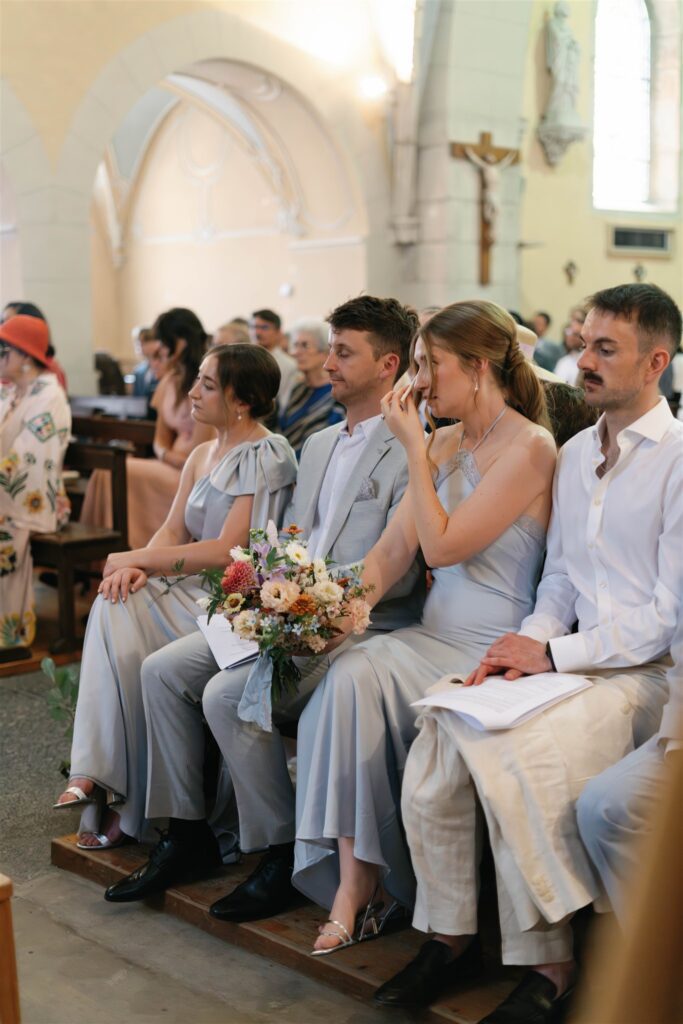 Guests in the pews during the ceremony, some wiping away tears