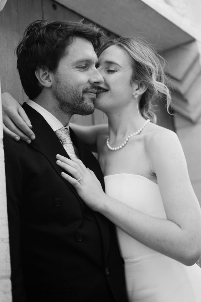 Black and white photo of Romy and Jonathan nuzzling each other