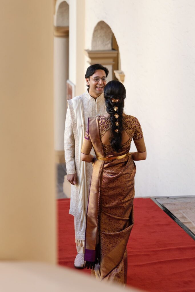 Tejus turning toward Advaitaa on the red carpet for their first look