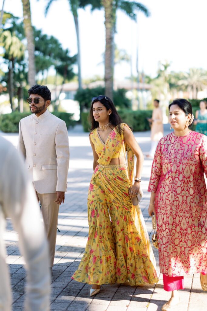 Guests in colorful South Asian attire arriving at the ceremony
