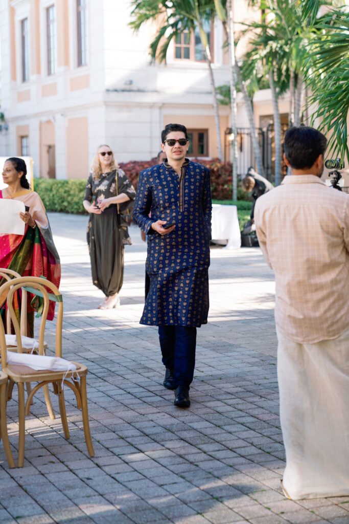 Guests walking through the courtyard on their way to the ceremony
