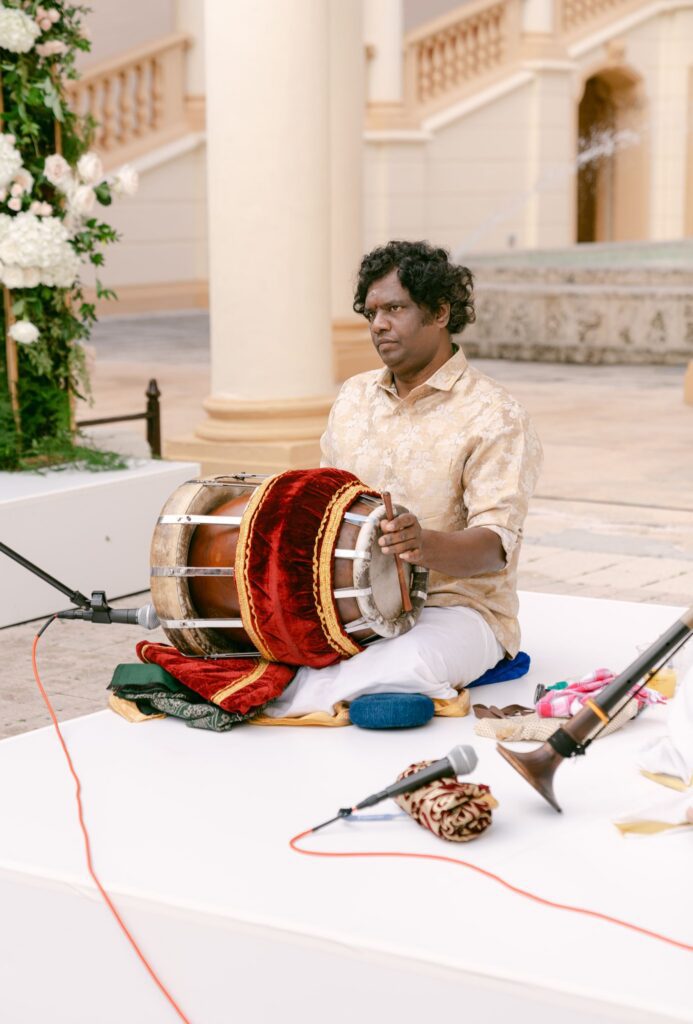 Musician playing a drum at the ceremony