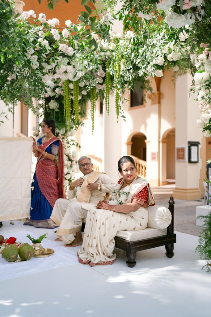 Family members seated on the mandap during the ceremony