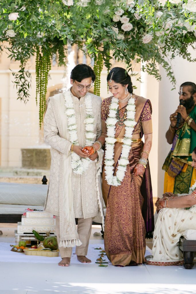 Advaitaa and Tejus wearing floral garlands during the ceremony