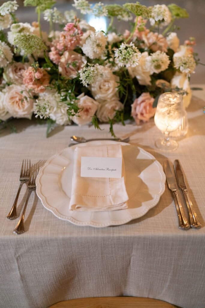 Place setting with blush roses and candles