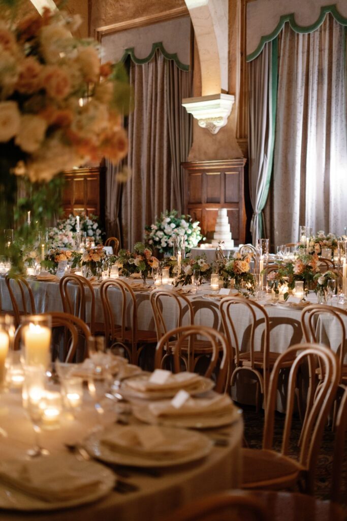 Candlelit tables and flowers in the reception room