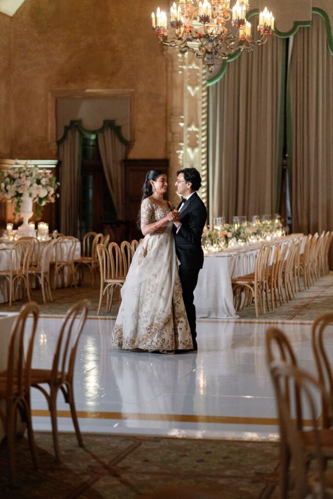 Advaitaa and Tejus sharing a quiet moment in the empty ballroom