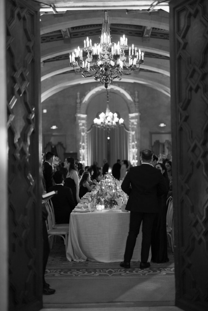 Black and white view through the doorway of the Granada Ballroom as guests gather