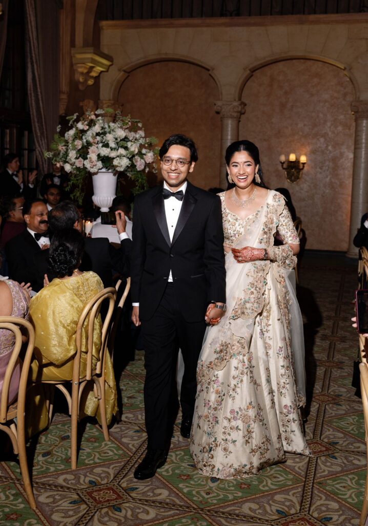 Advaitaa and Tejus entering the reception hand in hand