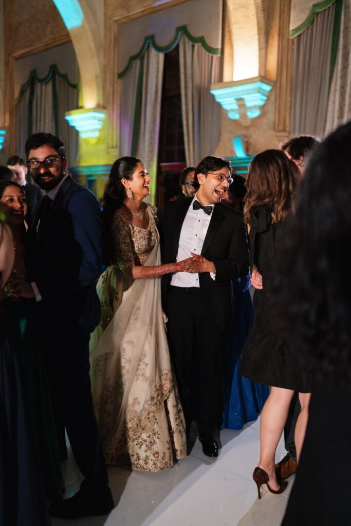 Advaitaa and Tejus greeting guests on the dance floor
