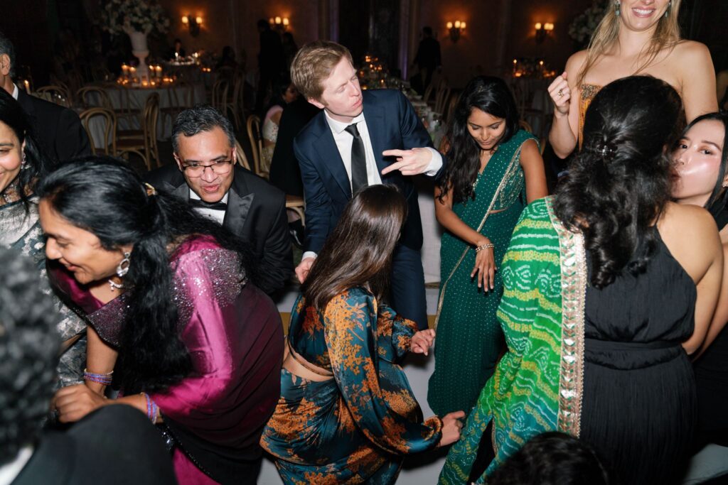 Guests dancing and celebrating in colorful attire