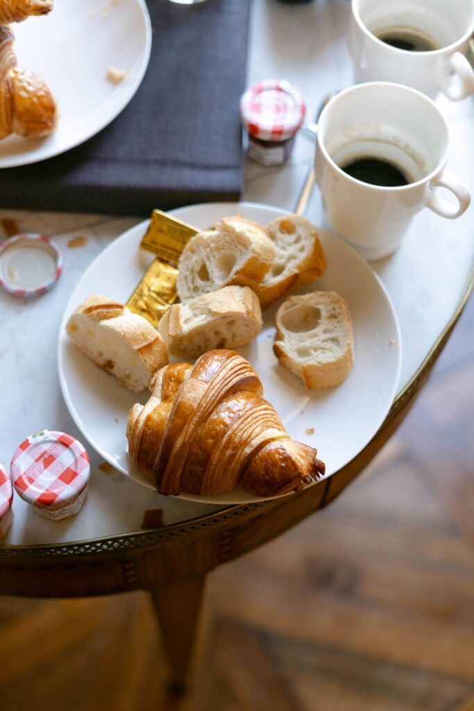 Croissant, bread, butter, jam and coffee for wedding breakfast