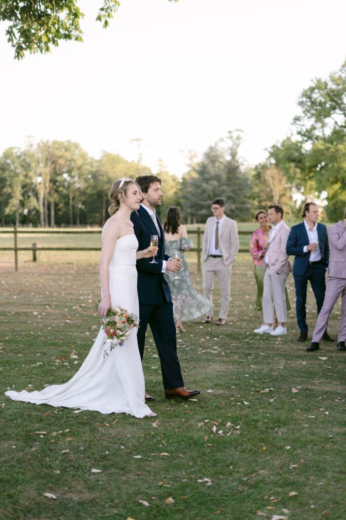 Bride and Groom joining their cocktail hour in Chateau's gardens