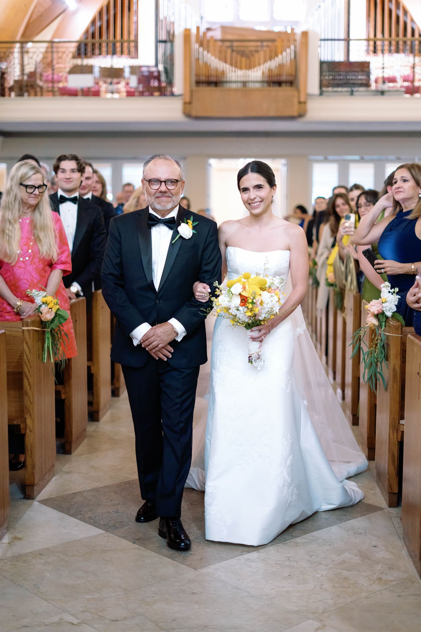 Ashley walking down the aisle at St. Thomas Episcopal Church with her father