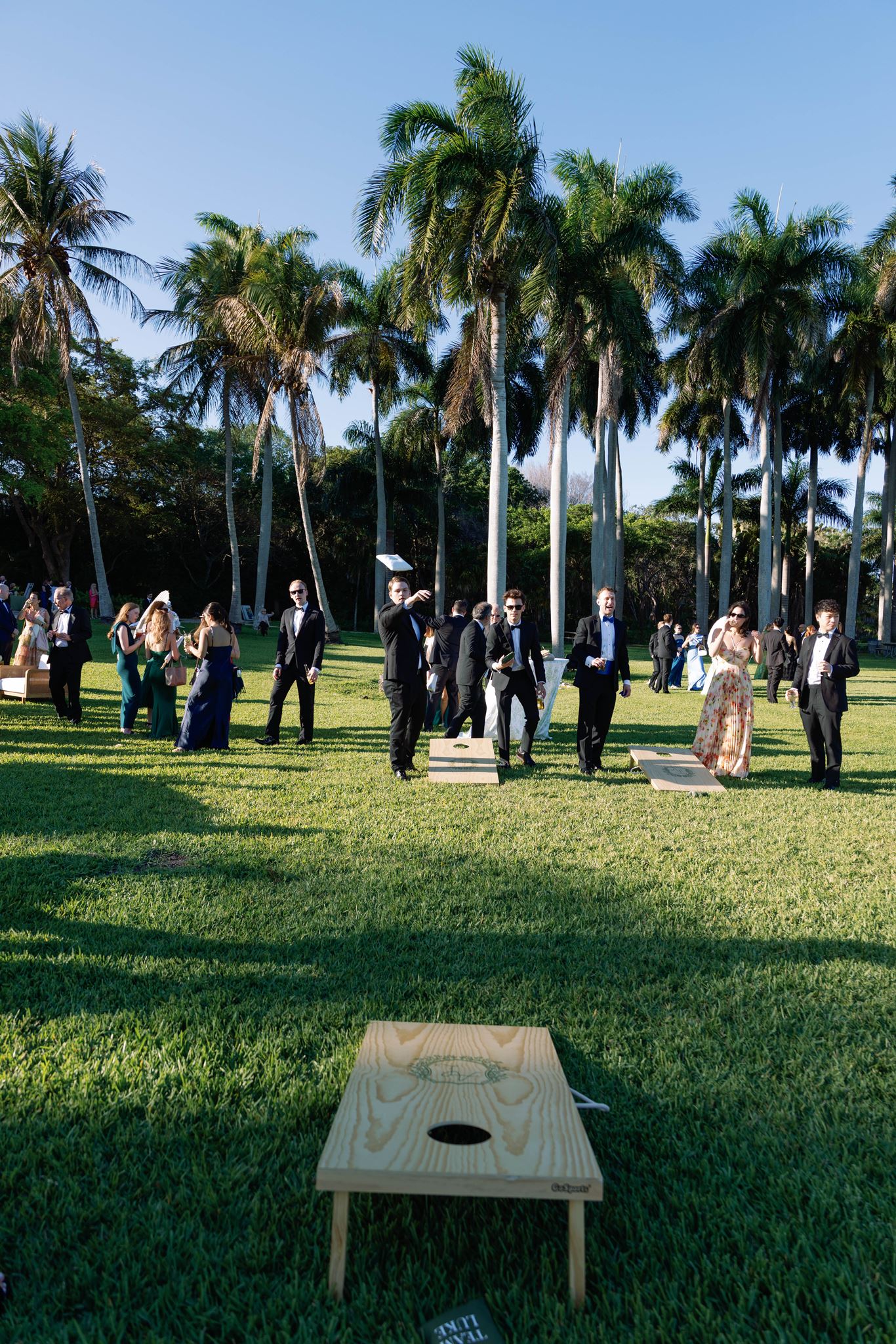 Cornhole game on the lawn at the Deering Estate during cocktail hour