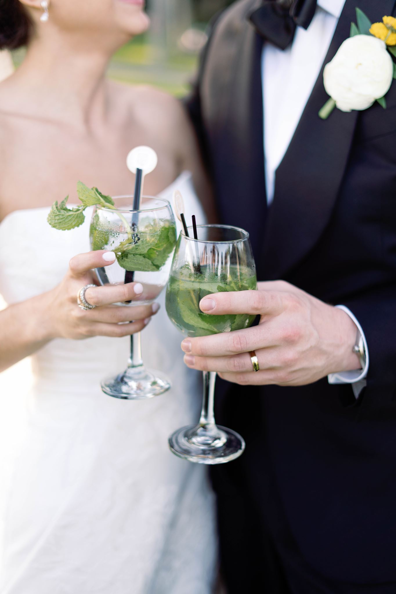 Ashley and Luke toasting with mojitos during cocktail hour