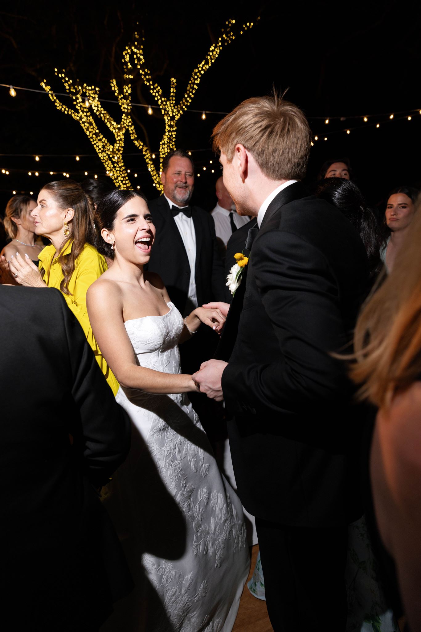 Ashley laughing with guests on the dance floor
