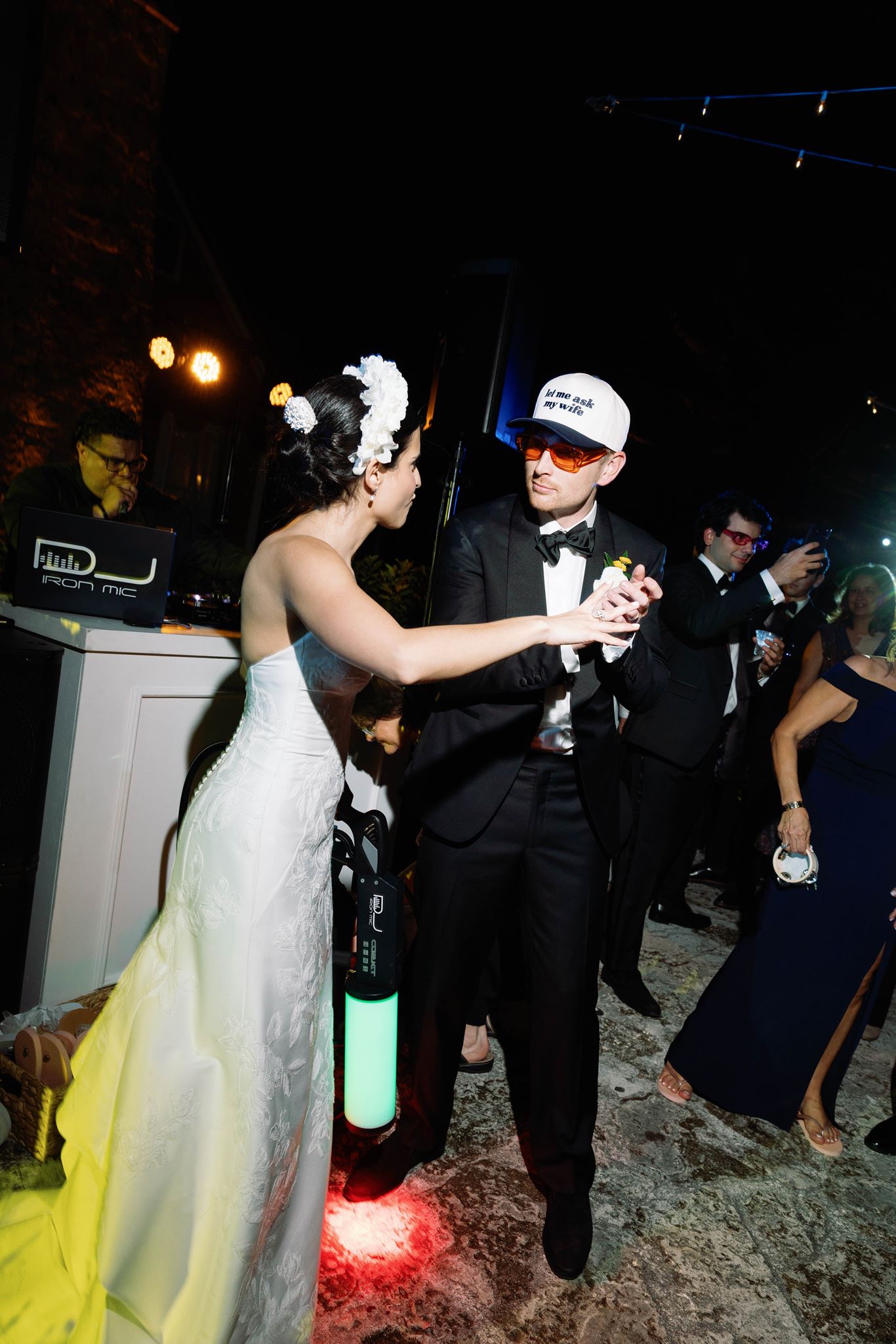 Ashley and Luke in hora loca caps and sunglasses on the dance floor