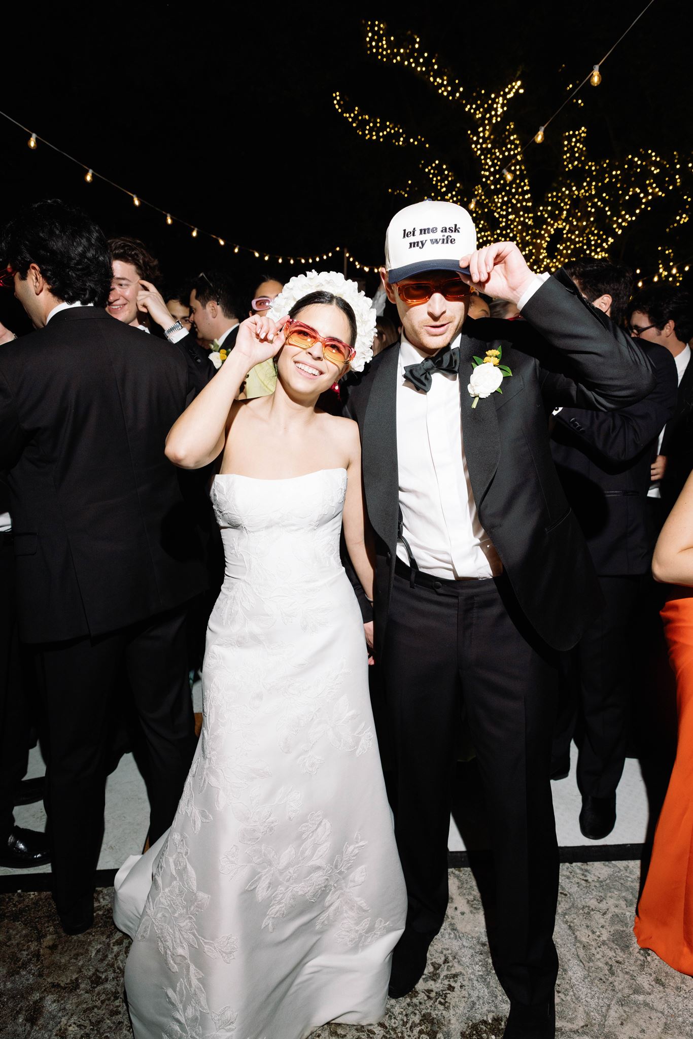 Ashley and Luke in hora loca caps and sunglasses on the dance floor