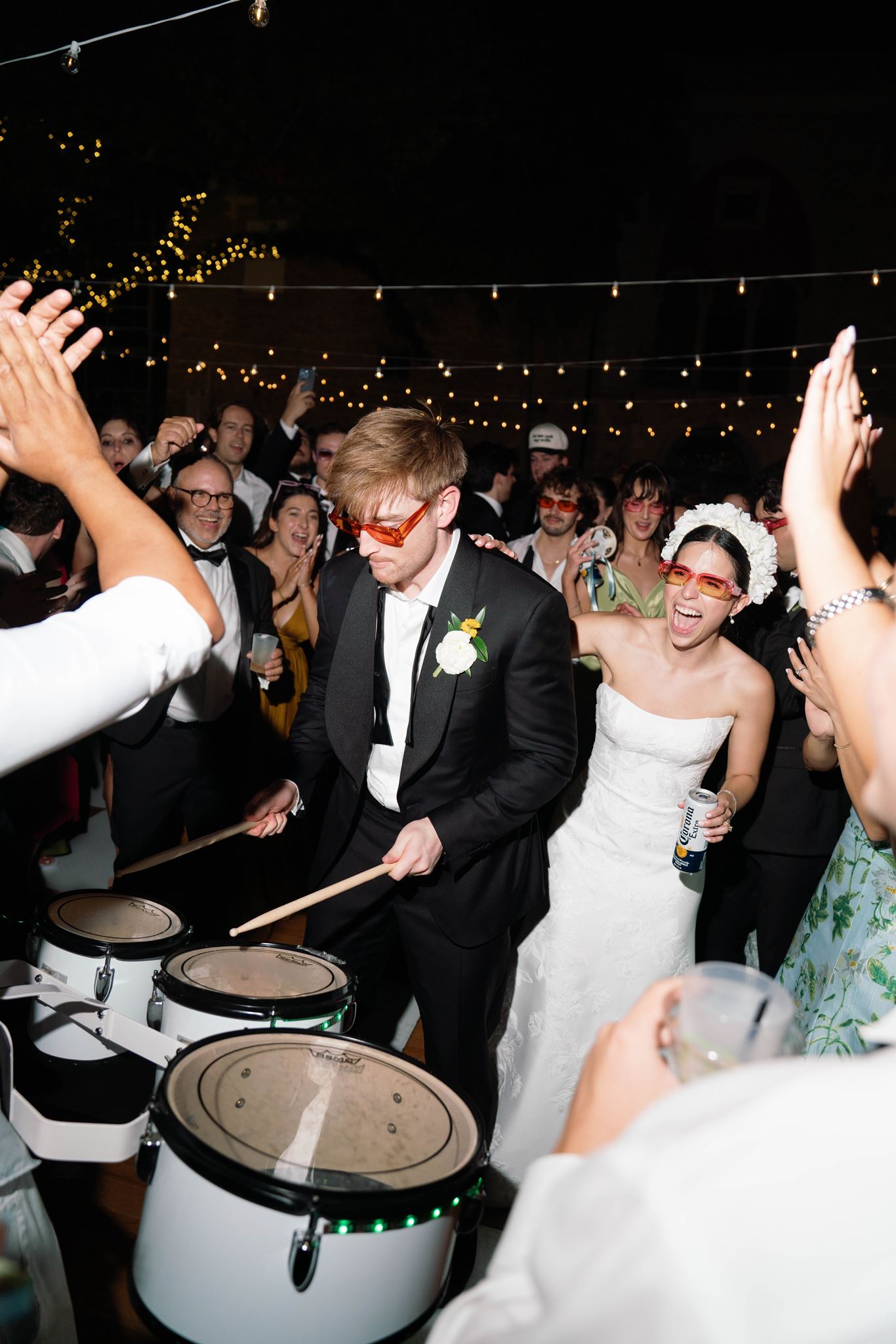 Luke playing the drums as Ashley dances during hora loca